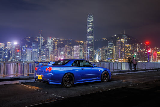 Nissan Skyline R34 GT-R in Hong Kong with Victoria Harbor in the background (24x36)
